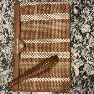 New Michael Kors clutch/wristlet with original tags included.